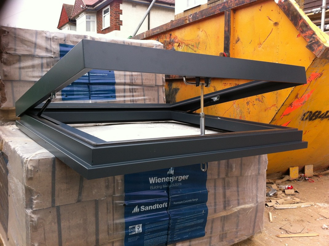 Opening flat roof skylight in anthracite grey installed in Regent's Park